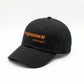 Black cotton baseball cap with curved brim and bright orange "Progressive AF Daily Kicks" embroidered text on front.
